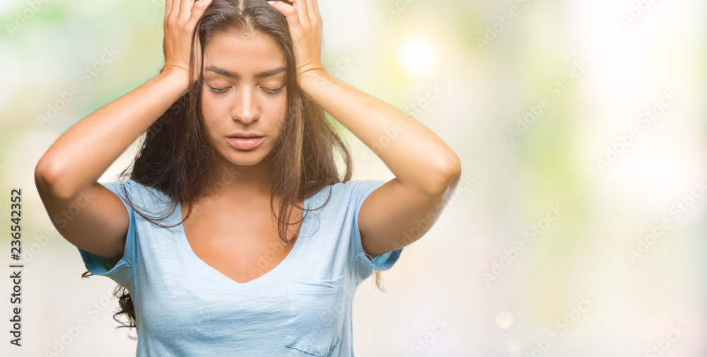 Young beautiful arab woman over isolated background suffering from headache desperate and stressed because pain and migraine. Hands on head. Young beautiful arab woman over isolated background suffering from headache desperate and stressed because pain and migraine. Hands on head.