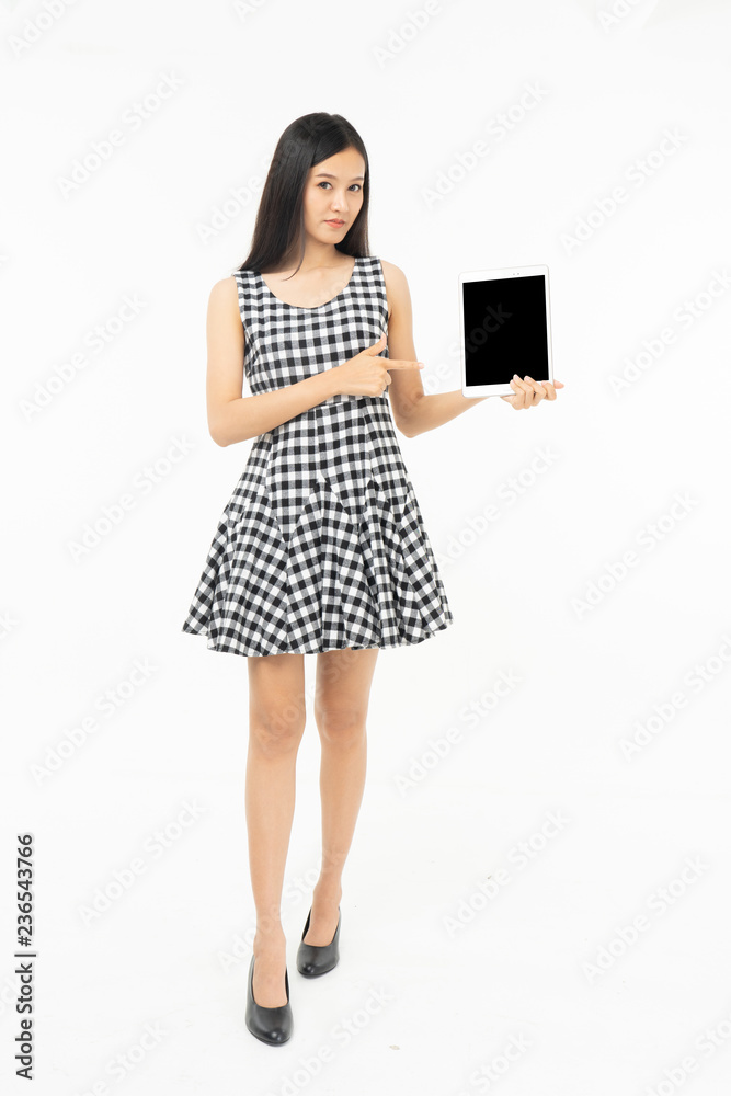 smiling beautiful asian woman holding tablet computer isolated on a white background. smiling beautiful asian woman holding tablet computer isolated on a white background.
