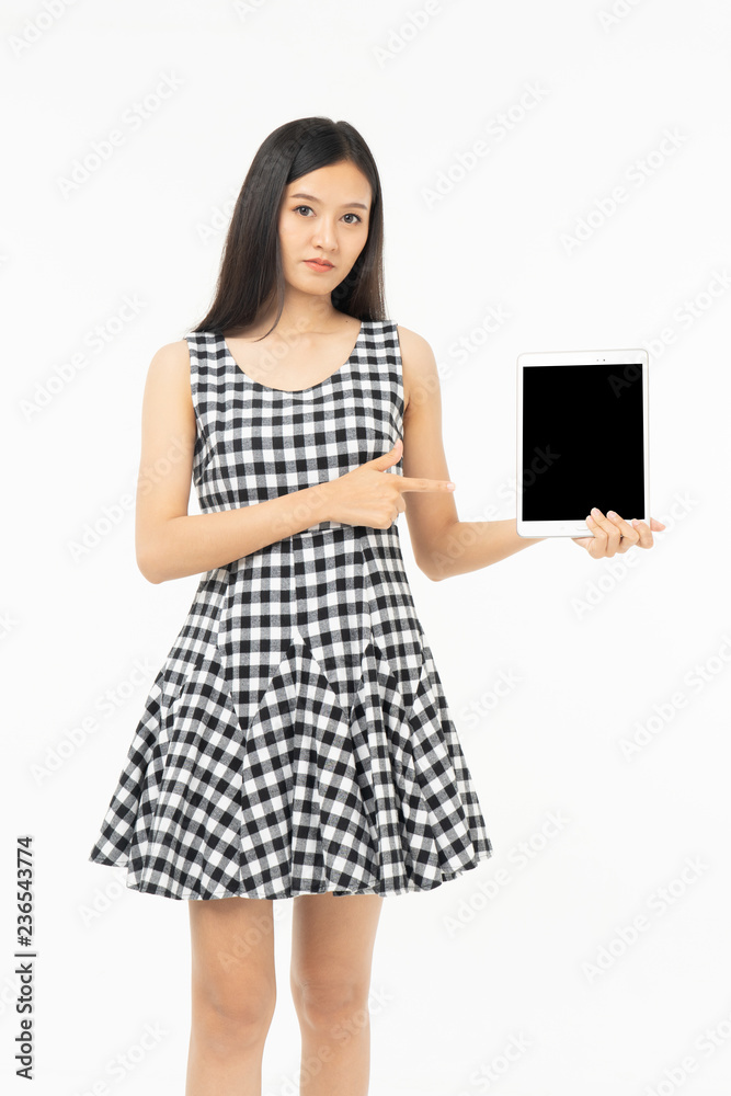 smiling beautiful asian woman holding tablet computer isolated on a white background. smiling beautiful asian woman holding tablet computer isolated on a white background.