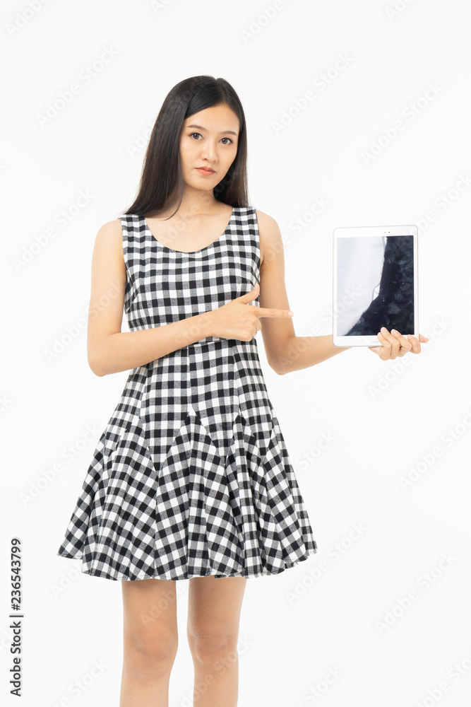 smiling beautiful asian woman holding tablet computer isolated on a white background. smiling beautiful asian woman holding tablet computer isolated on a white background.