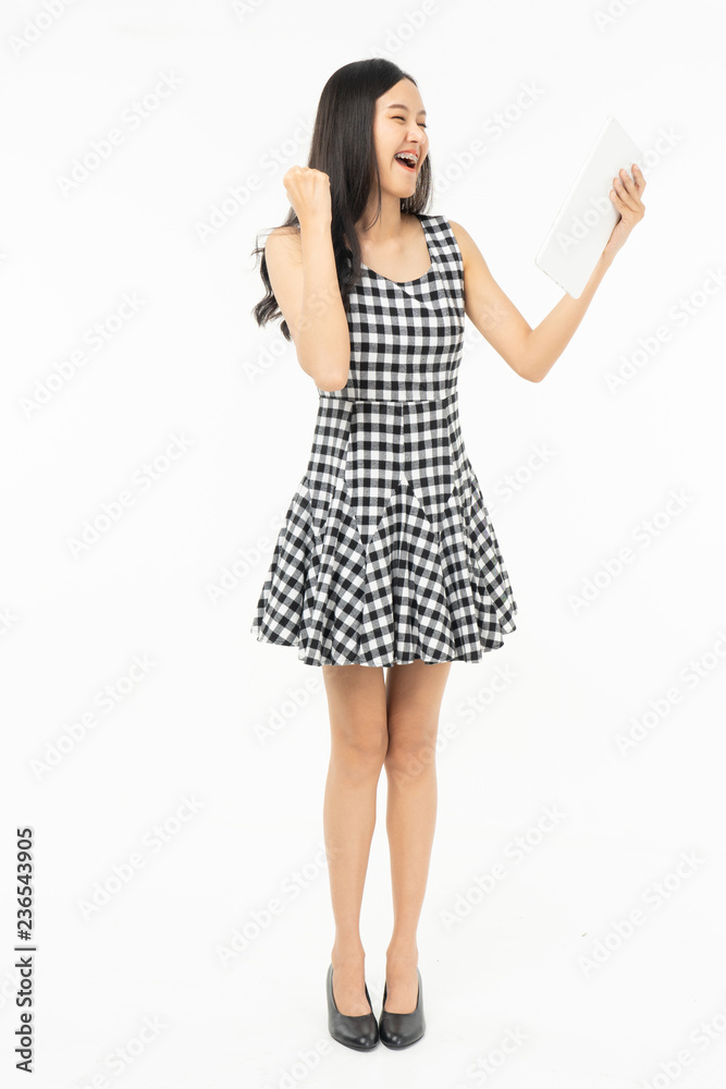  portrait of excited surprised attractive  inspired girl jumping up isolated on background.Freedom legs stylish feet glamorous people teenager asian.