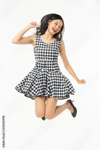  portrait of excited surprised attractive inspired girl jumping up isolated on background.Freedom legs stylish feet glamorous people teenager asian.