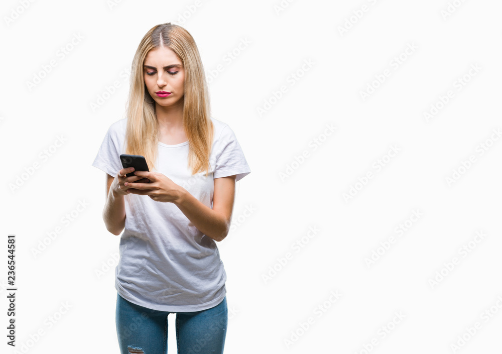 Young beautiful blonde woman using smartphone over isolated background with a confident expression on smart face thinking serious Young beautiful blonde woman using smartphone over isolated background with a confident expression on smart face thinking serious