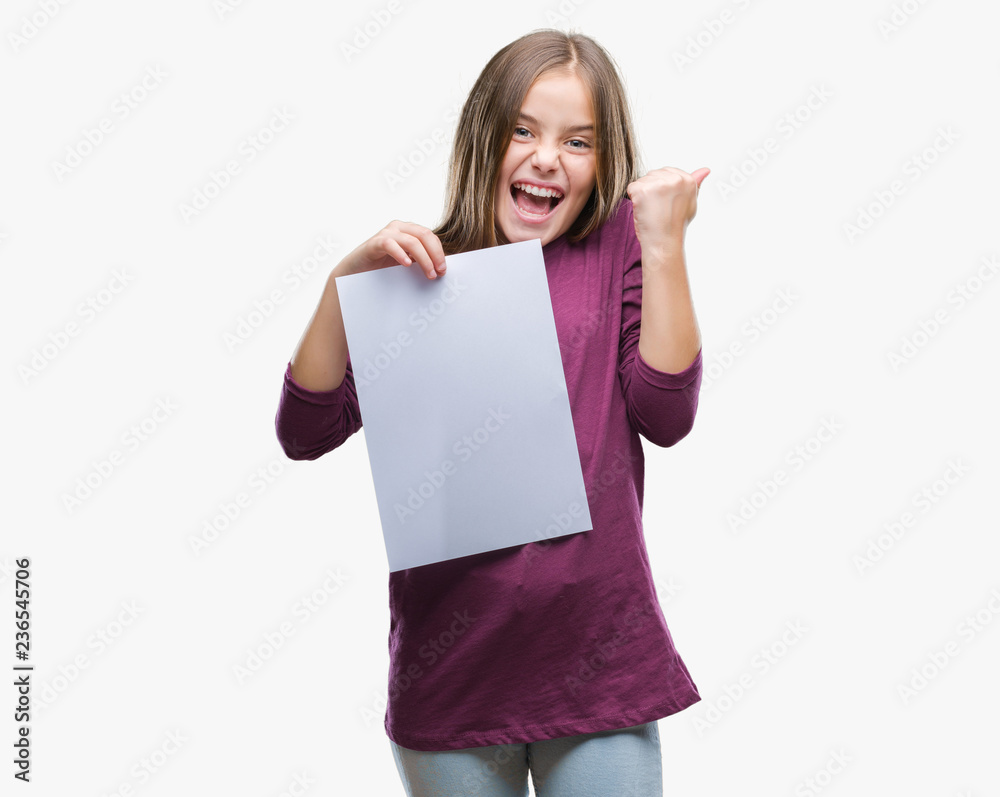 Young beautiful girl holding blank sheet paper over isolated background screaming proud and celebrating victory and success very excited, cheering emotion Young beautiful girl holding blank sheet paper over isolated background screaming proud and celebrating victory and success very excited, cheering emotion