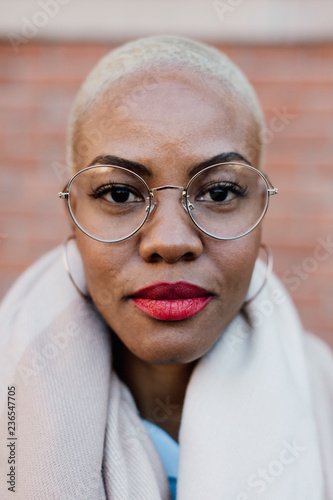 Closeup portrait of a chic latin woman looking at camera. 