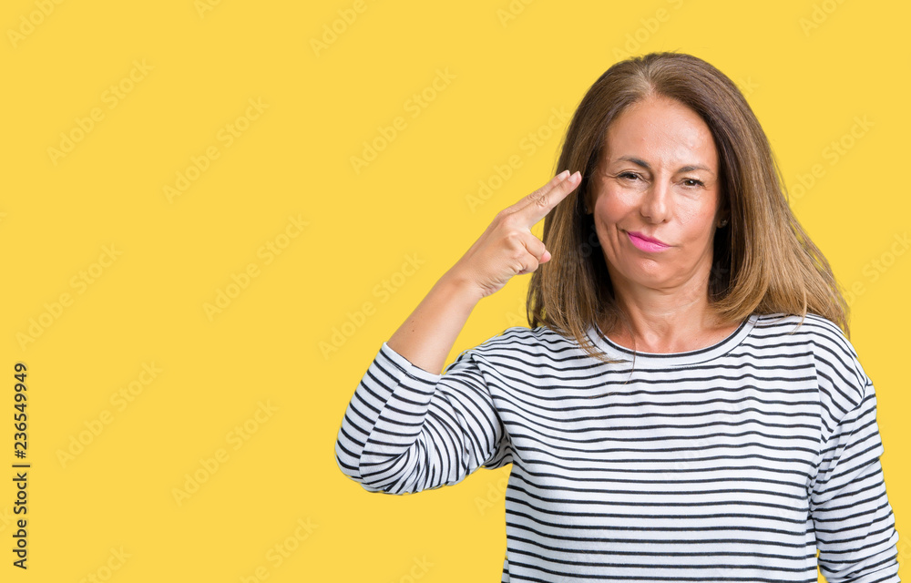 Beautiful middle age woman wearing stripes sweater over isolated background Shooting and killing oneself pointing hand and fingers to head, suicide gesture. Beautiful middle age woman wearing stripes sweater over isolated background Shooting and killing oneself pointing hand and fingers to head, suicide gesture.