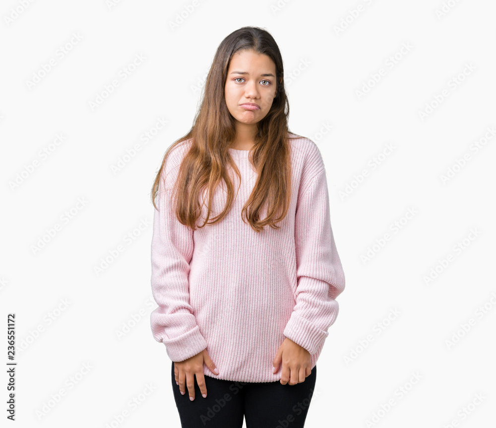 Young beautiful brunette woman wearing pink winter sweater over isolated background depressed and worry for distress, crying angry and afraid. Sad expression. Young beautiful brunette woman wearing pink winter sweater over isolated background depressed and worry for distress, crying angry and afraid. Sad expression.