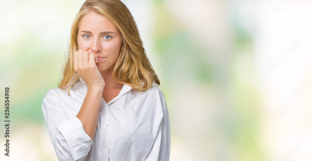 Beautiful young business woman over isolated background looking stressed and nervous with hands on mouth biting nails. Anxiety problem. Beautiful young business woman over isolated background looking stressed and nervous with hands on mouth biting nails. Anxiety problem.
