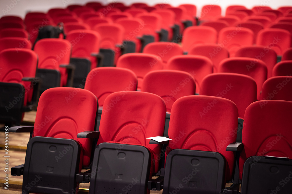 hall with rows of red seats