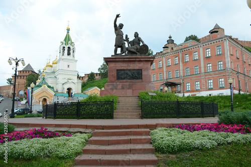 NIZHNY NOVGOROD, RUSSIA - JULY 16, 2018: Monument to Minin and Pozharsky near Church of St. John the Baptist in the city center photo