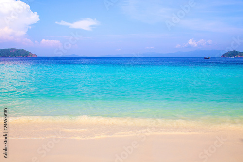 Beautiful beach and tropical sea with clear sky
