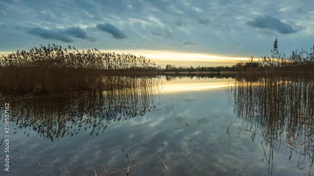 4k timelapse of beautiful lake after sunset with cloudy sky reflected in water. Beautiful Poland. 4096x2304 4k timelapse of beautiful lake after sunset with cloudy sky reflected in water. Beautiful Poland. 4096x2304