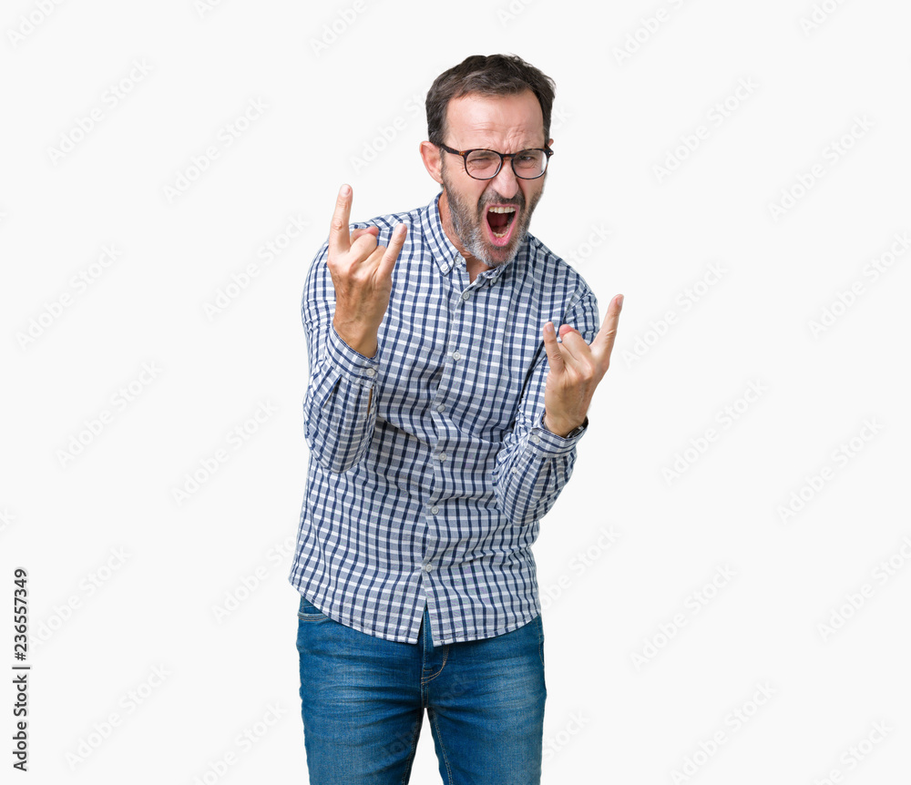 Handsome middle age elegant senior business man wearing glasses over isolated background shouting with crazy expression doing rock symbol with hands up. Music star. Heavy concept.
