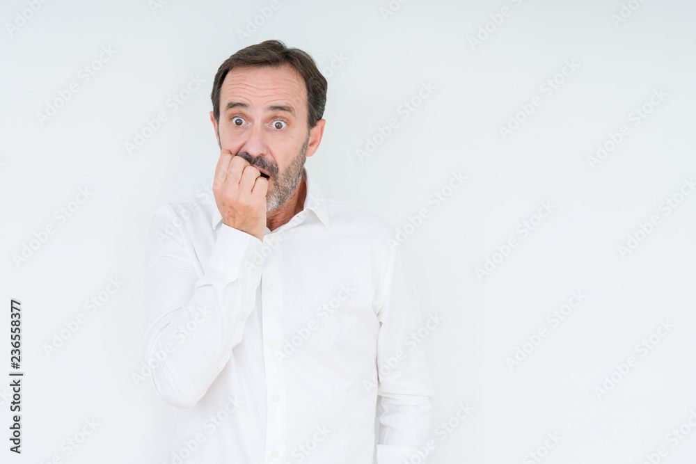 Elegant senior man over isolated background looking stressed and nervous with hands on mouth biting nails. Anxiety problem. Elegant senior man over isolated background looking stressed and nervous with hands on mouth biting nails. Anxiety problem.