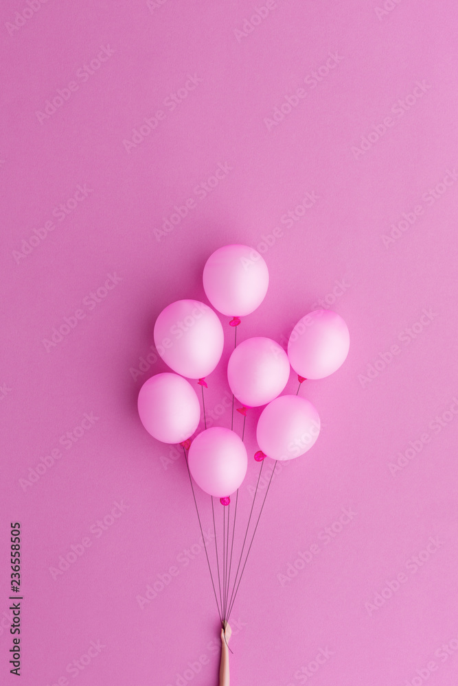 Doll's hand holding pink balloons Doll's hand holding pink balloons