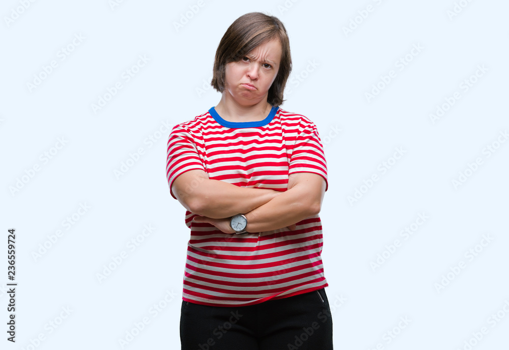 Young adult woman with down syndrome over isolated background skeptic and nervous, disapproving expression on face with crossed arms. Negative person. Young adult woman with down syndrome over isolated background skeptic and nervous, disapproving expression on face with crossed arms. Negative person.