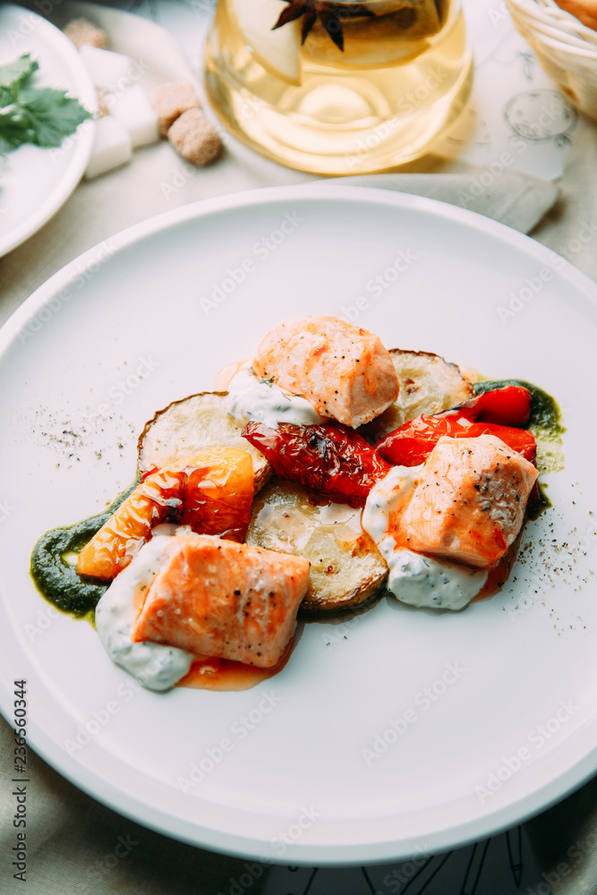 Steak of fish cooked on the grill. Restaurant dishes with a beautiful serving. Steak of fish cooked on the grill. Restaurant dishes with a beautiful serving.