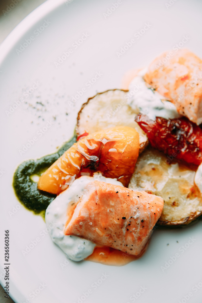 Steak of fish cooked on the grill. Restaurant dishes with a beautiful serving. Steak of fish cooked on the grill. Restaurant dishes with a beautiful serving.