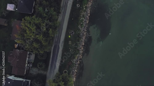 Bird caught flying over Lake Erie near Selkirk, Ontario, Canada. photo