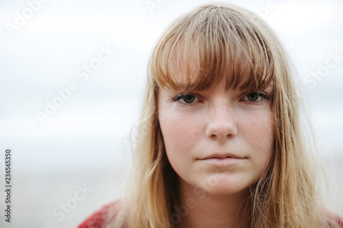 Serious teenage girl staring at camera