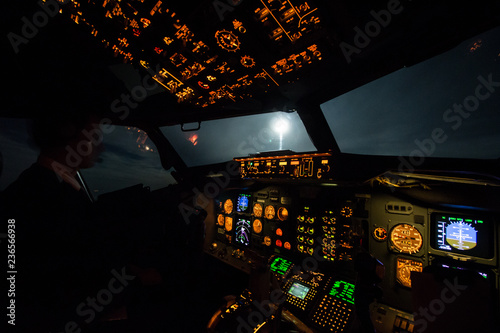 The pilots enjoy the full moon from the flight deck