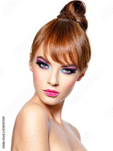Beautiful woman with creative hairstyle and vivid make-up.