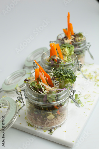 Vegetarian food. Glass jers with cereal salad isolated. photo