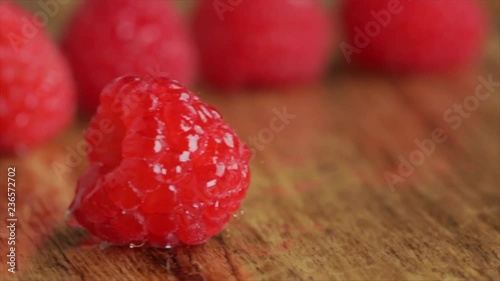 Raspberries Lying on a Wooden Table or Board, Tracking Shot, Closeup