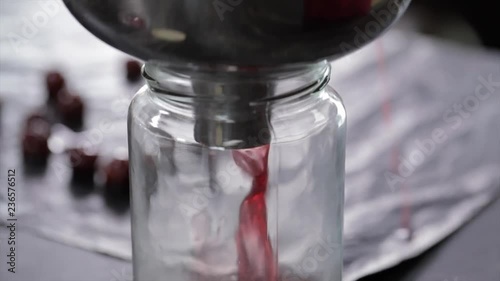Liquid Cherry Jelly is Filled into a Big Mason Jar, Closeup
