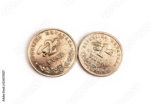 Croatian money, one and two kuna сoins, averse and reverse, isolated on white background. HRK currency, macro view. Finance, banking and business in Croatia concept.