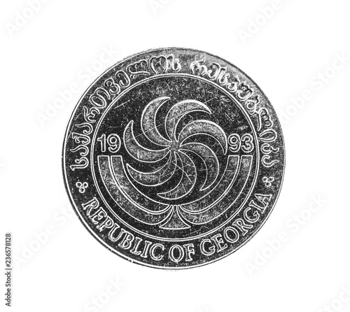 Georgian money, metal сoin averse on white background. Otsi Tetri, lari, GEL currency, macro view. Finance, banking and business in Georgia concept.