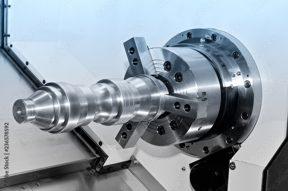 Metal detail in a spindle of the industrial lathe. Blue toned.