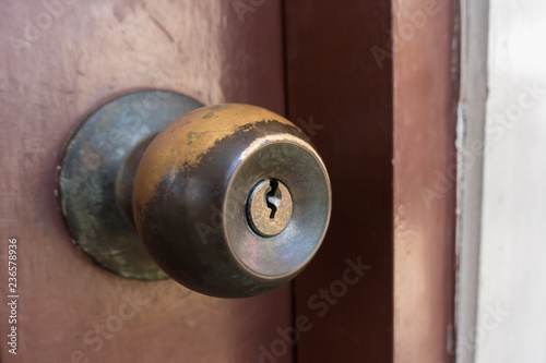 Old Door Knobs on wood door. Door lock