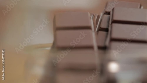 Chocolate Bars in a Glass Bowl - Camera Pans from the left to right, Blur becomes Sharpness, Closeup