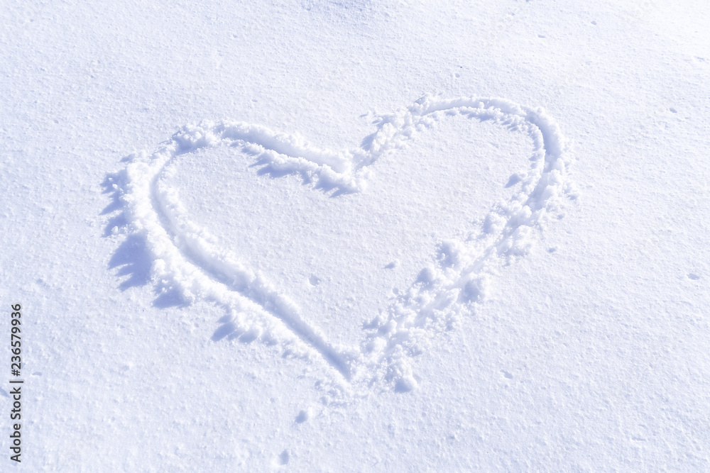 Handwriting heart shaped on snow