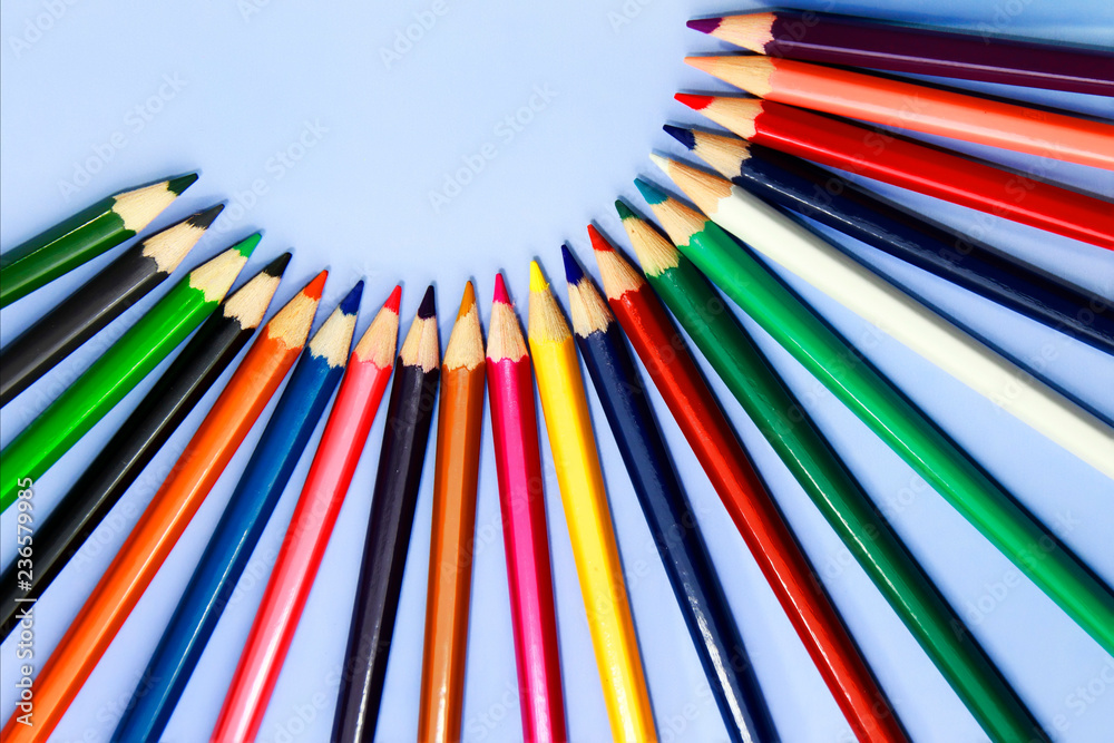 colorful pencil on blue paper background colorful pencil on blue paper background