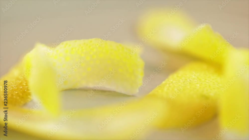 Lemon peel on a wooden rotating table, wandering focus, Closeup Lemon peel on a wooden rotating table, wandering focus, Closeup