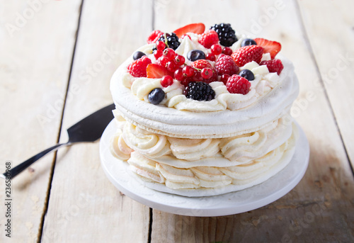 Gourmet pavlova cake with fresh berry topping photo