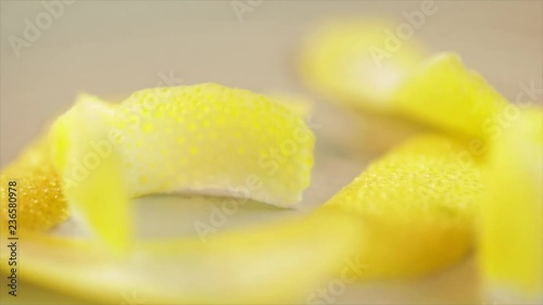 Lemon peel on a wooden rotating table, wandering focus, Closeup