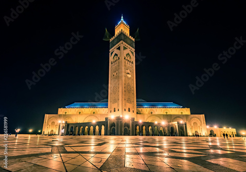 CASABLANCA, MOROCCO - NOVEMBER 15, 2018: Night view of Mosque of Hassan II in Casablanca. The Hassan II Mosque is the largest mosque in Morocco, the second largest in Africa