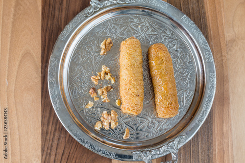 Turkish dessert dolma kadayifi on metal tray top view photo