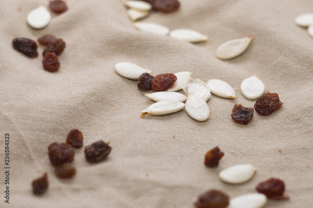 Raisins and pumpkin seeds, vegetarian food, healthy eating concept Raisins and pumpkin seeds, vegetarian food, healthy eating concept