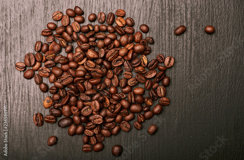 coffee beans in shape of heart on wooden background