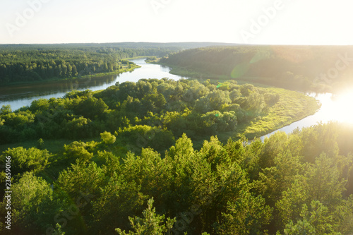 Scenic view from Merkine observation tower to Nemunas river, streaming between dense pine forests.