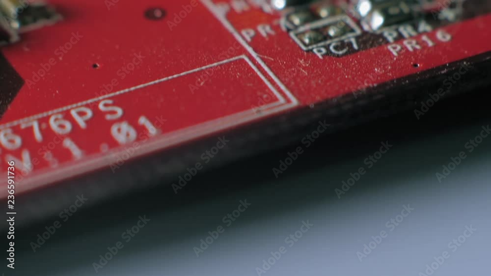 Computer parts macro closeup. Camera moving above structures of chips, microchips and processors on used board. Computer parts macro closeup. Camera moving above structures of chips, microchips and processors on used board.