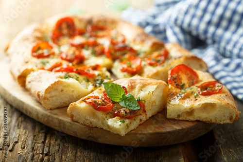 Tableau sur toile Tomato focaccia with fresh basil