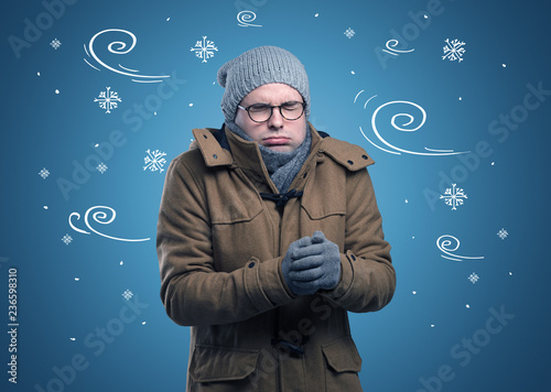 Young hipster frozen boy with doodled snowflakes and windy concept
 photo