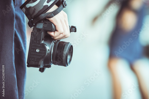 Professional photographer landscape with dslr camera in smart woman hands for ready to take pictures, Photographers takes snapshots for pleasure to remember events, vintage tone