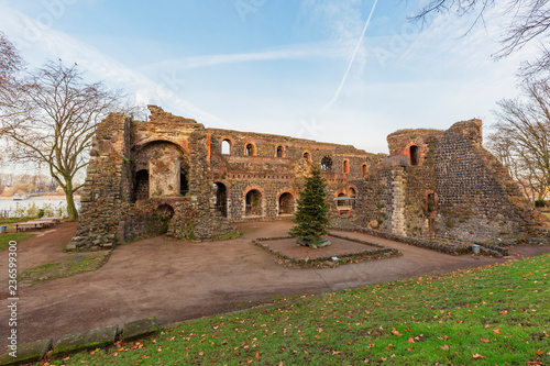 View to Ruins of the Kaiserpfalz (english: Emperor Palatinate) with big walls and the River Rhine in the background,  Duesseldorf, Germany