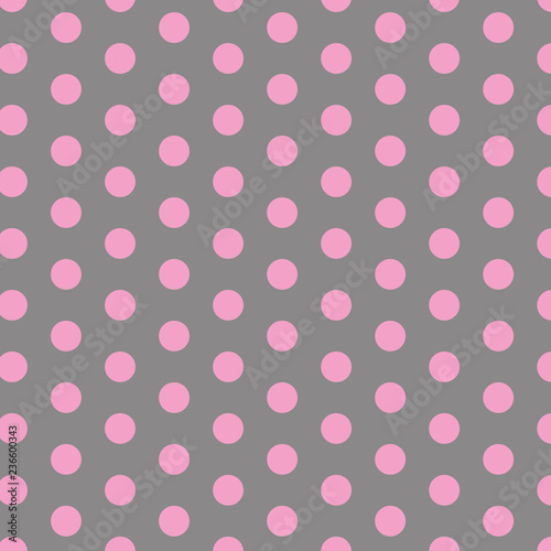 Polka dot pattern. Pink circles on grey background. 